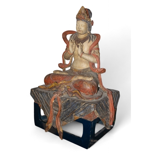 396 - Chinese18th Century or earlierA large and rare carved painted wood figure of Kuan Yin, the Bodhisatt... 