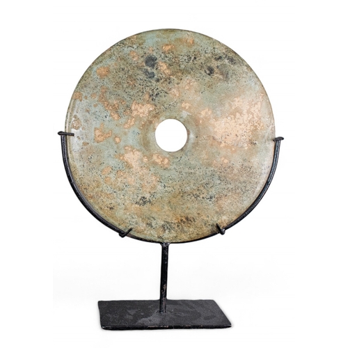 400 - ChineseA mottled jade disk on metal standDimensions:(Disk) 12 in. (D)(Incl. stand) 16.5 in. (H) x 12... 