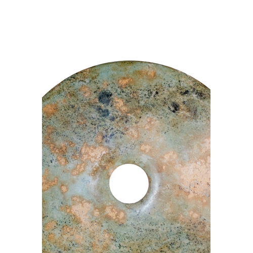 400 - ChineseA mottled jade disk on metal standDimensions:(Disk) 12 in. (D)(Incl. stand) 16.5 in. (H) x 12... 