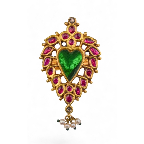 41 - Mughal style20th CenturyA high carat yellow metal dress ringThe heart shaped green glass centre with... 