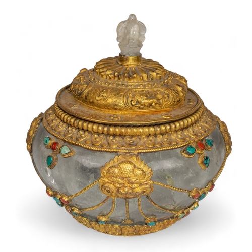 411 - Tibetan, 19th CenturyA rock crystal and gilt silver extensively carved bowl with cover and inset tur... 