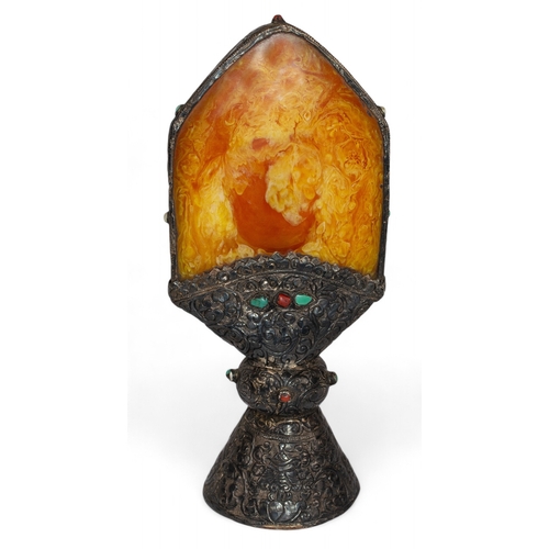 412 - Tibetan19th CenturyAn amber silver carved seal with inset turquoise and carnelianDimensions:9.5 in. ... 