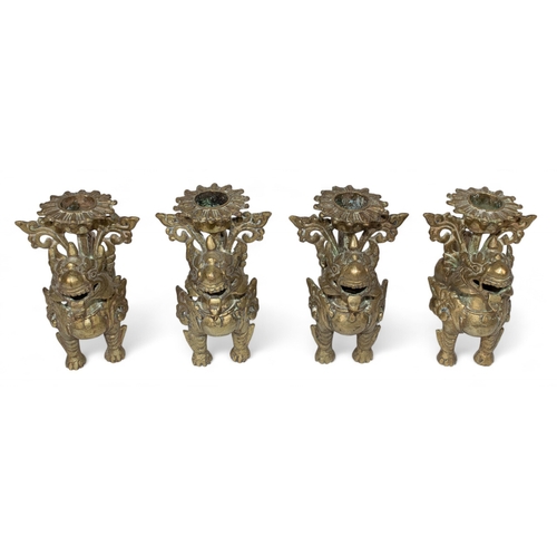 417 - ChineseFour foo dog brass candlesticksDimensions:4 in. (H) x 3.5 in. (W) x 2.5 in. (D)... 