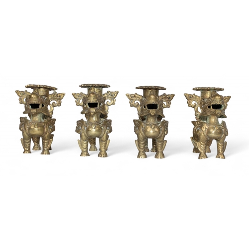 417 - ChineseFour foo dog brass candlesticksDimensions:4 in. (H) x 3.5 in. (W) x 2.5 in. (D)... 