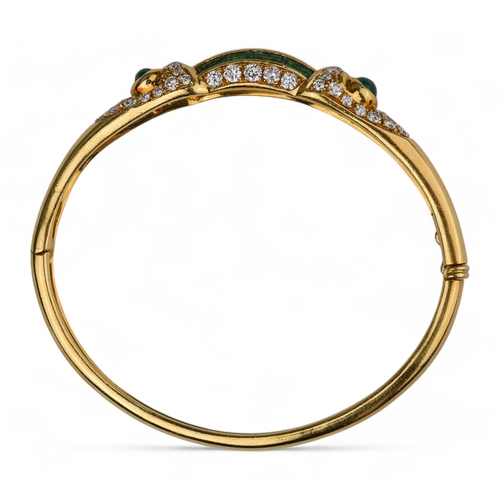 42 - ChaumetLondonCirca 1980An elegant 18 carat gold, calibré emerald and diamond bangleThe front arched ... 