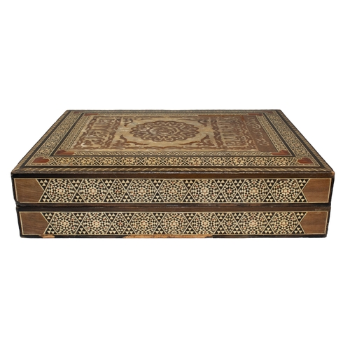 420 - Islamic20th CenturyAn inlaid wood and mother of pearl Quran boxDimensions: 3.75 in. (H) x 15.5 in. (... 