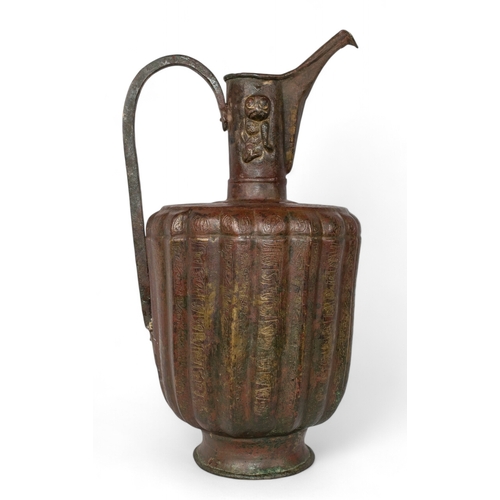 423 - Persia12th century (?)A Khorasan copper inlaid bronze ewer, of slightly flaring lobed form on a spla... 