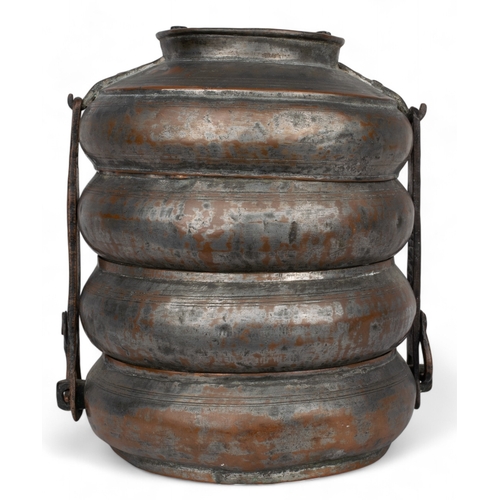 439 - Probably IslamicA brass tiffin boxWith four tiers and a brass handleDimensions:9 in. (H) x 6.5 in. (... 