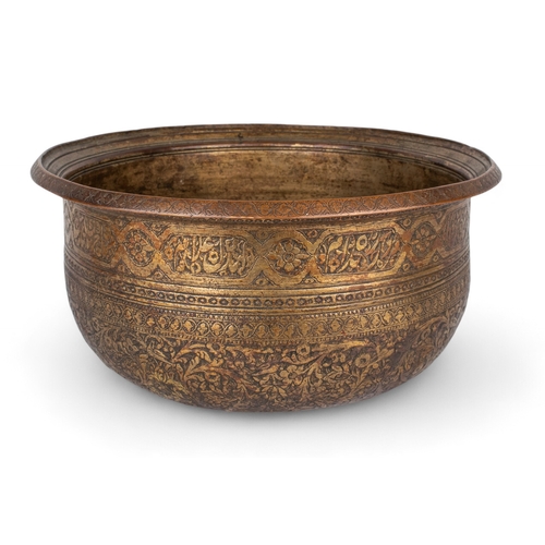 468 - Persian (?)16th century (?)A large copper wine basin, extensively engraved and inlaid with black com... 