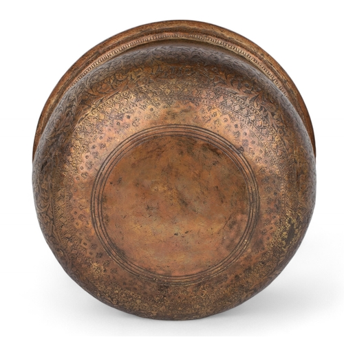 468 - Persian (?)16th century (?)A large copper wine basin, extensively engraved and inlaid with black com... 