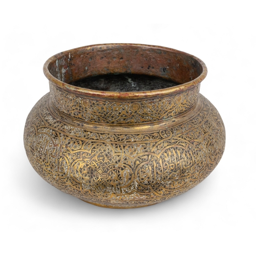 472 - Central Asia or Iran17th - 18th centuryA brass bowl, of compressed rounded shape on a flattened circ... 