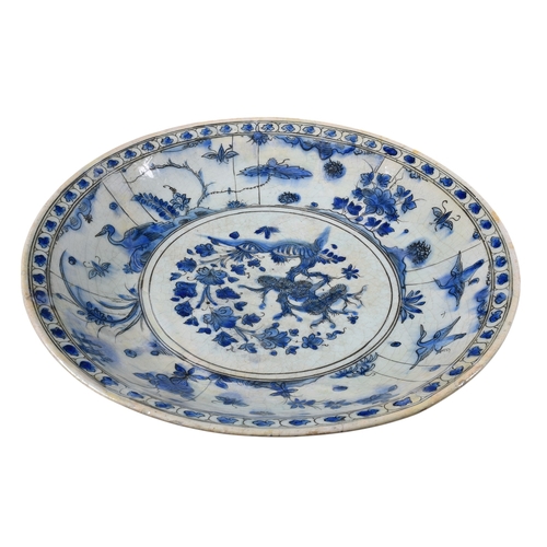 477 - Persian, Safavid17th centuryA large blue and white bowlDimensions:17.5 in. (D)... 