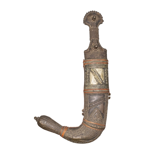 484 - 20th centuryYemeni (?) A jambiya, with an ornate accompanying sheath. The hilt and sheath are heavil... 