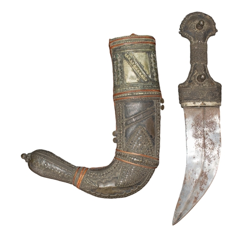 484 - 20th centuryYemeni (?) A jambiya, with an ornate accompanying sheath. The hilt and sheath are heavil... 