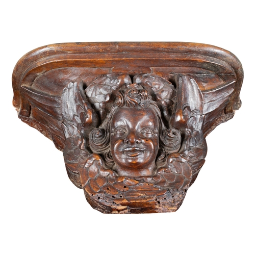 511 - BrugesEarly 17th centuryA misericord with winged angel headCarved oakDimensions:9 in. (H) x 14 in. (... 