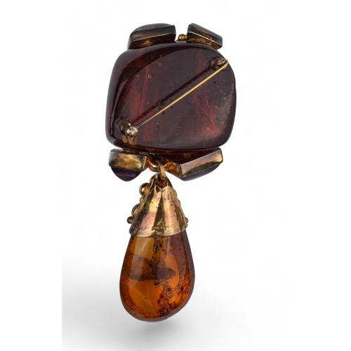 81 - Eileen CoyneContemporaryCirca 1980A large and unusual natural amber and amethyst pendant broochSigne... 