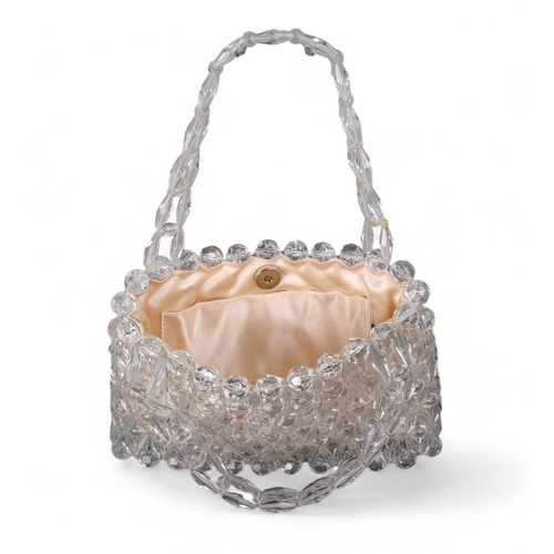 85 - 1990s, Bottega VenetaA top handle evening handbag with white satin interior lining and exterior bead... 