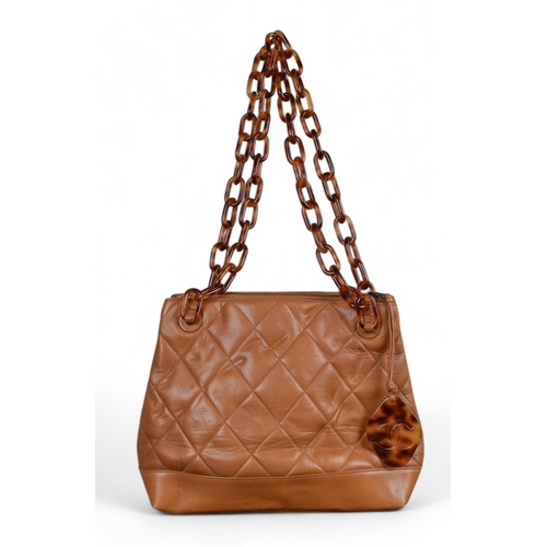 86 - Circa 1995, ChanelA caramel quilted lambskin CC shoulder tote bag with faux tortoiseshell handlesDim... 