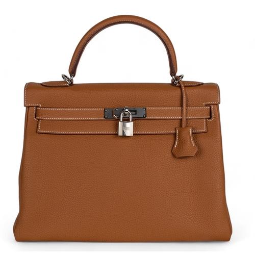 87 - Hermès2020A Kelly 32 retourne in gold togo leatherWith the clochette, keys, and padlock, and ... 