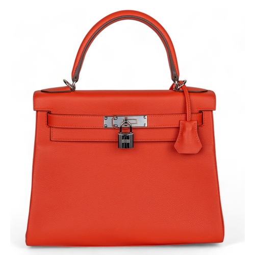 88 - Hermès2023A Kelly 28 retourne in capucine evercolour leatherWith the clochette, keys, and pad... 