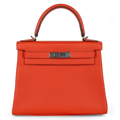 88 - Hermès2023A Kelly 28 retourne in capucine evercolour leatherWith the clochette, keys, and pad... 