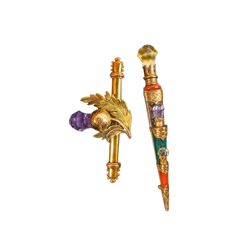 9 - ScottishCirca 1880Two brooches[a] A dirk brooch mounted in yellow gold, with jasper, amethyst, and c... 