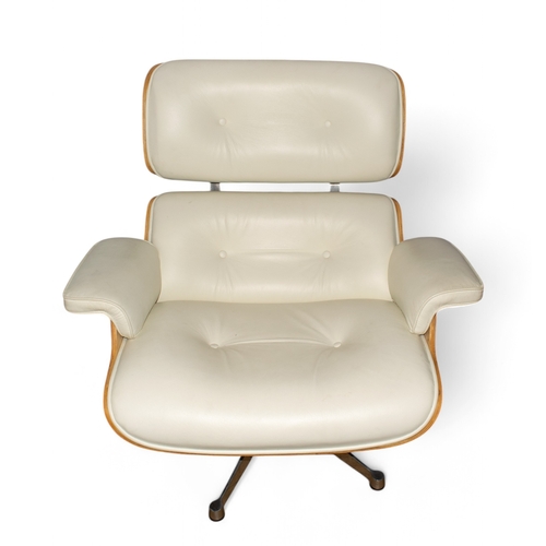 96 - After Charles EamesA white leather lounge chair and ottomanDimensions:28 in. (H) x 35 in. (W) x 27 i... 