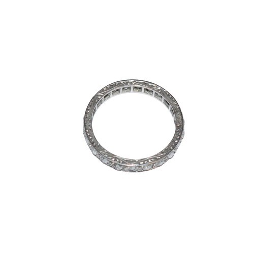 43 - BritishCirca 1920A diamond and platinum hoop ringComprising a row of old brilliant cut diamondsRing ... 