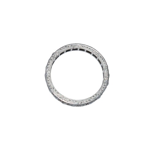 43 - BritishCirca 1920A diamond and platinum hoop ringComprising a row of old brilliant cut diamondsRing ... 