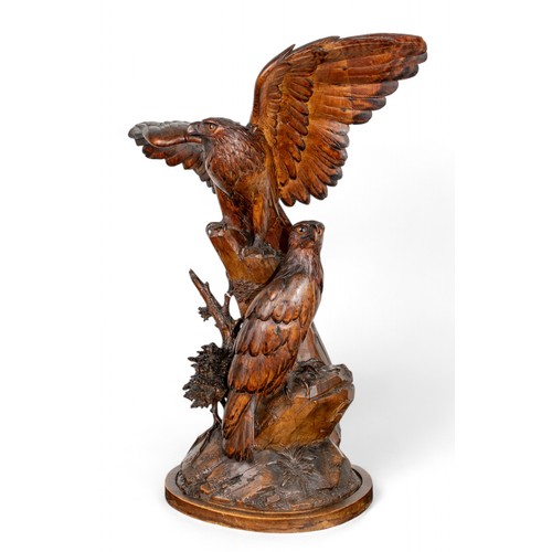 163 - Continental, 20th centuryA Black Forest carving of two eaglesDimensions:24 in. (H) x 21 in. (W)... 