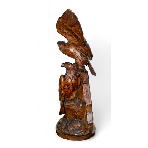 163 - Continental, 20th centuryA Black Forest carving of two eaglesDimensions:24 in. (H) x 21 in. (W)... 