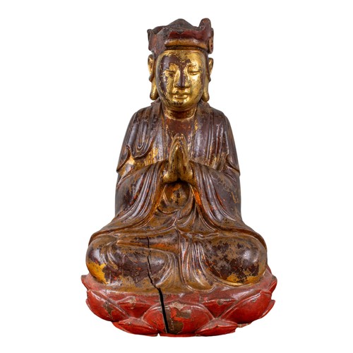 408 - Antique,A carved and lacquered Buddha at prayer with traces of polychrome and gilding, seated upon a... 