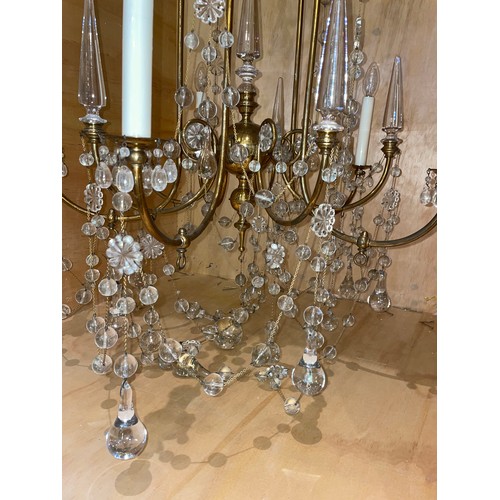 130 - Late 19th/Early 20th centuryA pair of five branch chandeliersLacquered brass and glassWith tubular s... 