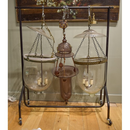 131A - 20th CenturyTwo similar George III style inverted bell-shaped glass hall lanterns. Each with dish-sh... 