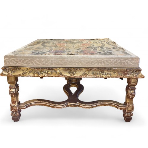 101 - BritishAntiqueAn early gilded table with 18th century tapestried topDimensions:18 in. (H) x 32 in. (... 