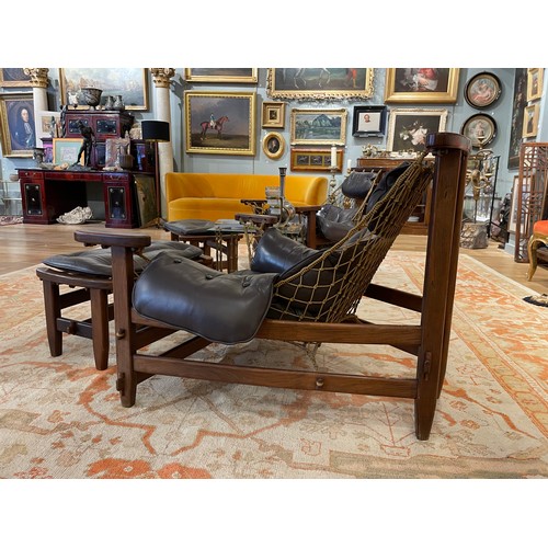 105 - Jean Gillon, Brazilianc.1960sA pair of jangada MCM Brazilian rosewood leather lounge chairs and otto... 