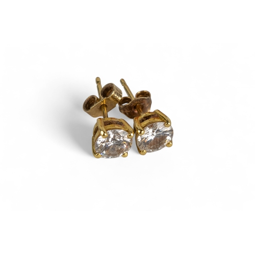 15 - BritishContemporaryA pair of diamond single stone ear studs. Each round brilliant cut diamond weighi... 