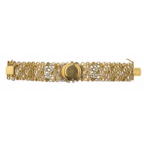 48 - John DonaldBritishCirca 1970An unusual 18 carat gold and diamond lady's bracelet wristwatchThe oval ... 