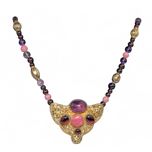 57 - Eileen CoyneAmericanContemporaryAn amethyst, rose quartz and garnet sautoir pendant necklaceThe fron... 