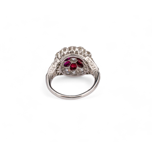 58 - British, Circa 1910A fine ruby and diamond flower head cluster ring mounted in platinum.The central ... 