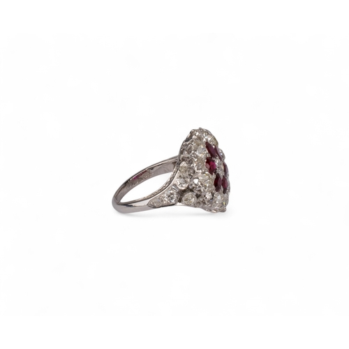 58 - British, Circa 1910A fine ruby and diamond flower head cluster ring mounted in platinum.The central ... 