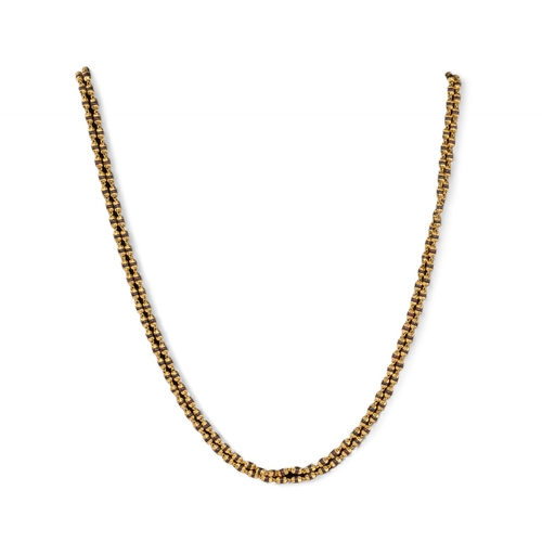 76 - Indian, ContemporaryA high carat yellow gold and wood bead necklace.The fluted yellow gold beads wit... 