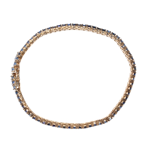 86 - Italian, Contemporary,A highly flexible and finely mounted square-cut sapphire line bracelet.Mounted... 