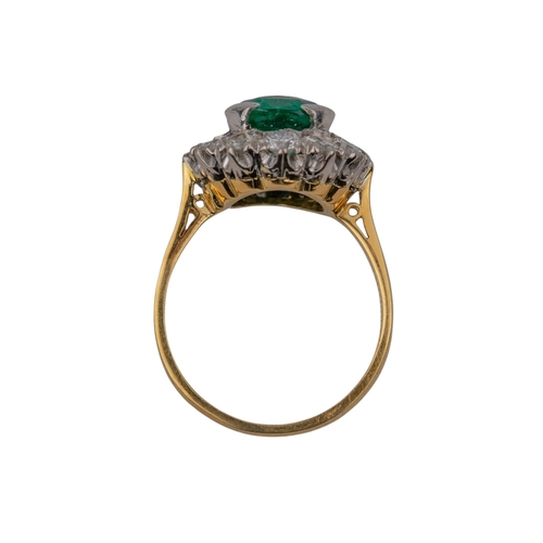 98 - ContinentalCirca 1955A fine emerald and diamond cluster ringThe mixed cut cushion shaped Columbian e... 