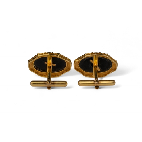 105 - Continental, Circa 1960sA striking pair of single-stone diamond, black onyx and yellow gold cufflink... 