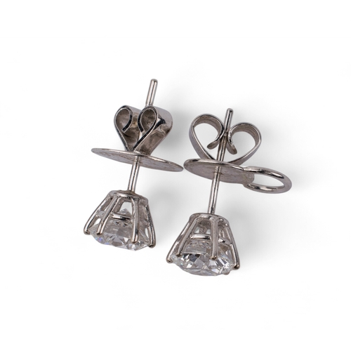 112 - Continental, Circa 1990sA fine pair of diamond single stone ear studs.The diamonds weighing 1.34 car... 