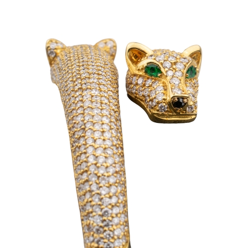 113 - Continental, ContemporaryA fine quality diamond and emerald panther bangle.The two overlapping panth... 