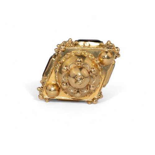 129 - ContinentalCirca 1960An 18 carat yellow gold and filigree garnet set lantern pendantWeight: Approx. ... 