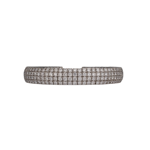 134 - Continental, ContemporaryAn 18 carat white gold pave set diamond cuff bangle.Set throughout with fou... 