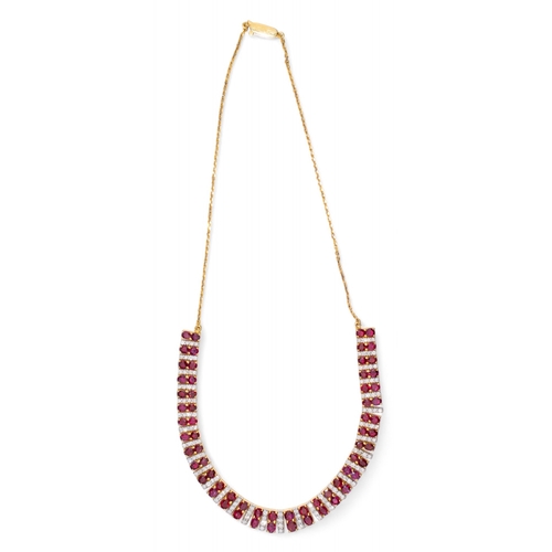 136 - Continental, Circa 1980s,An attractive ruby and diamond line fringe necklace.The front set with 64 s... 